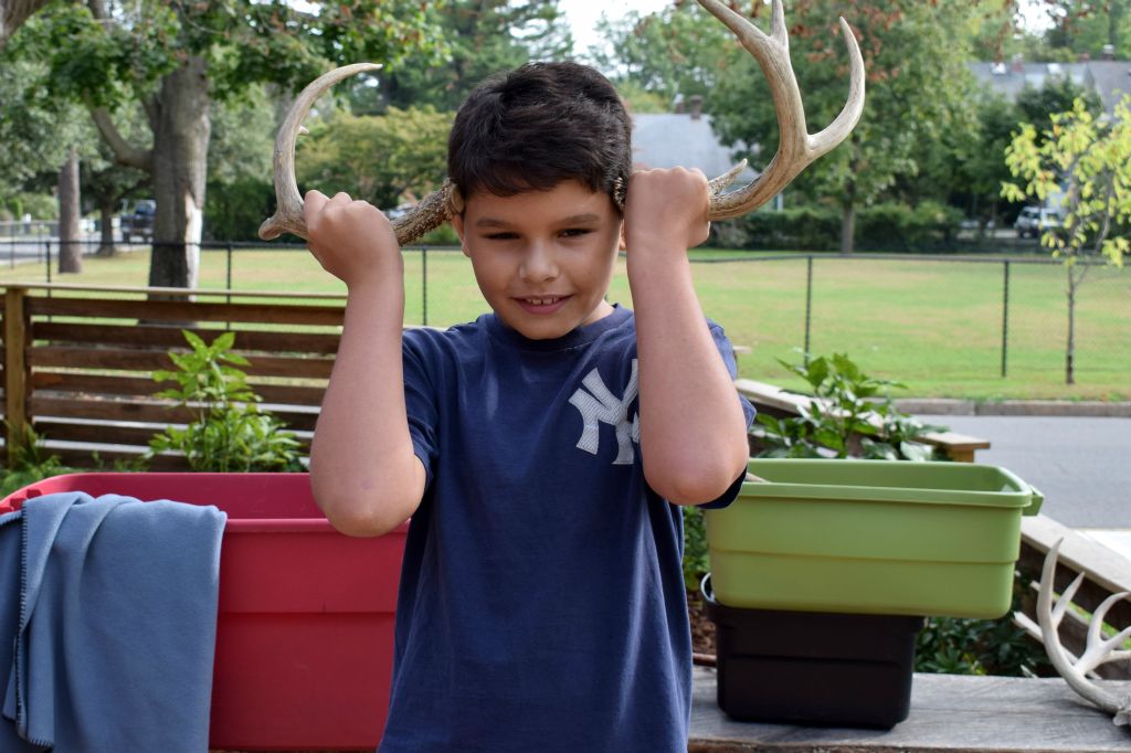 student with antlers 